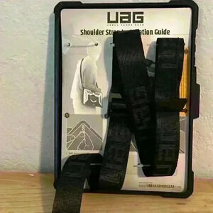 Microsoft, urban armor gear case, shoulder strap, and hand strap new, never used